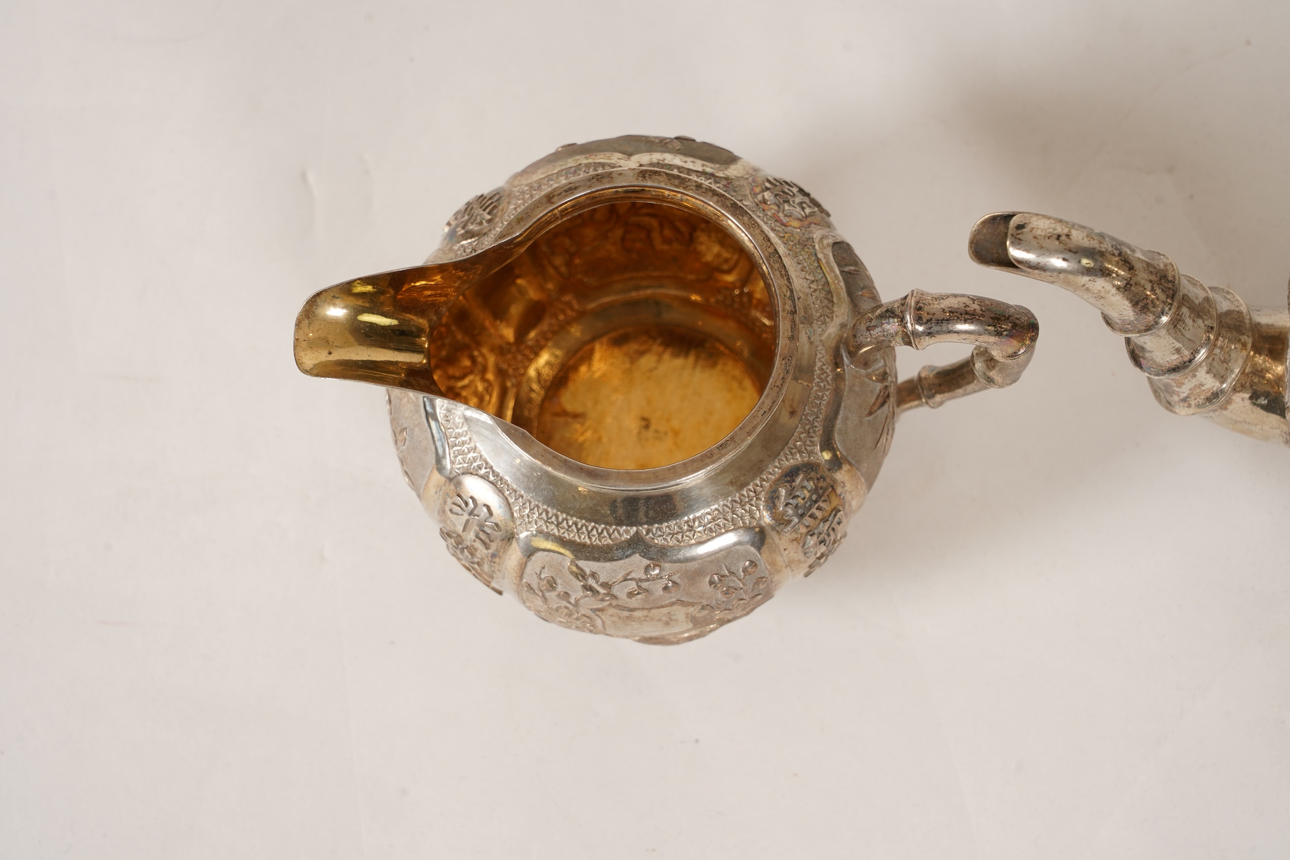 A late 19th/early 20th century Chinese Export white metal three-piece tea set, maker's mark WA